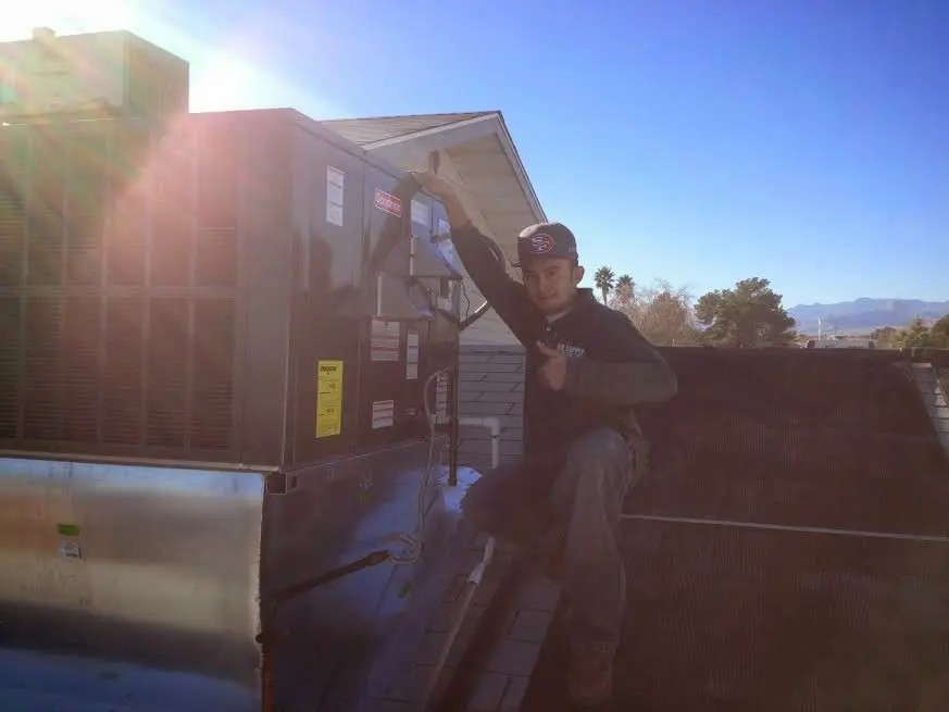 HVAC technician performing HVAC Inspection on a rooftop unit in West Rockhill